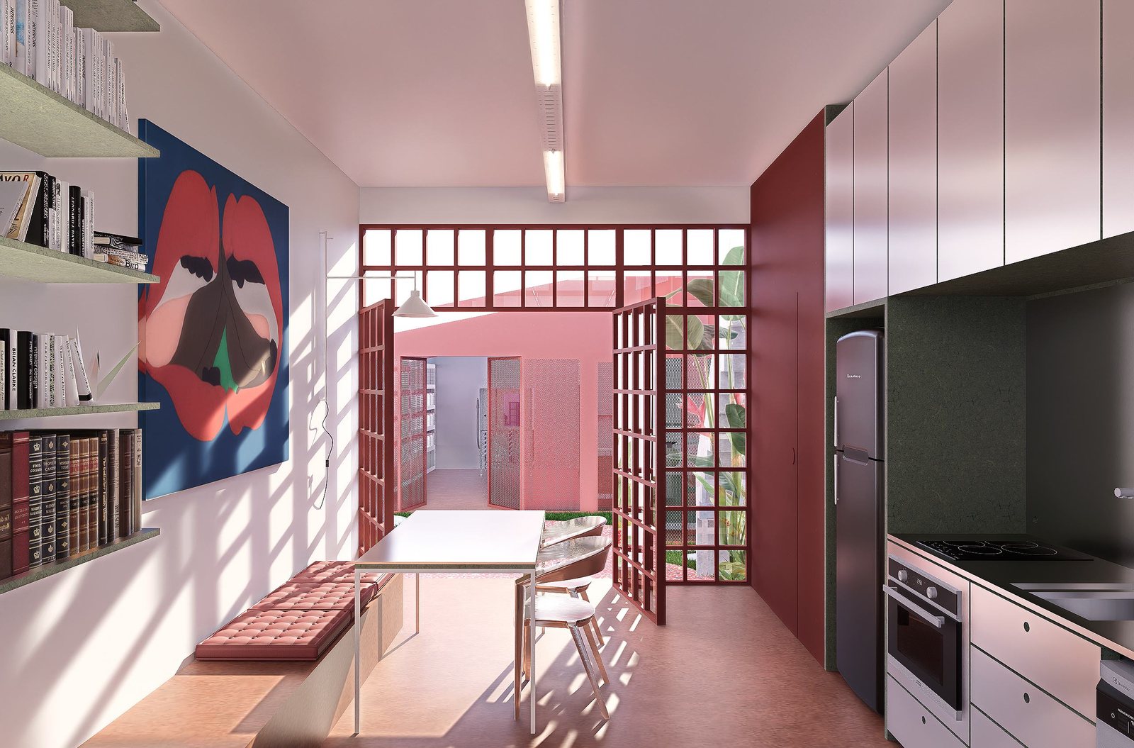 Interior do Ateliê Nave Mãe com grelha vermelha, obras de arte e cozinha